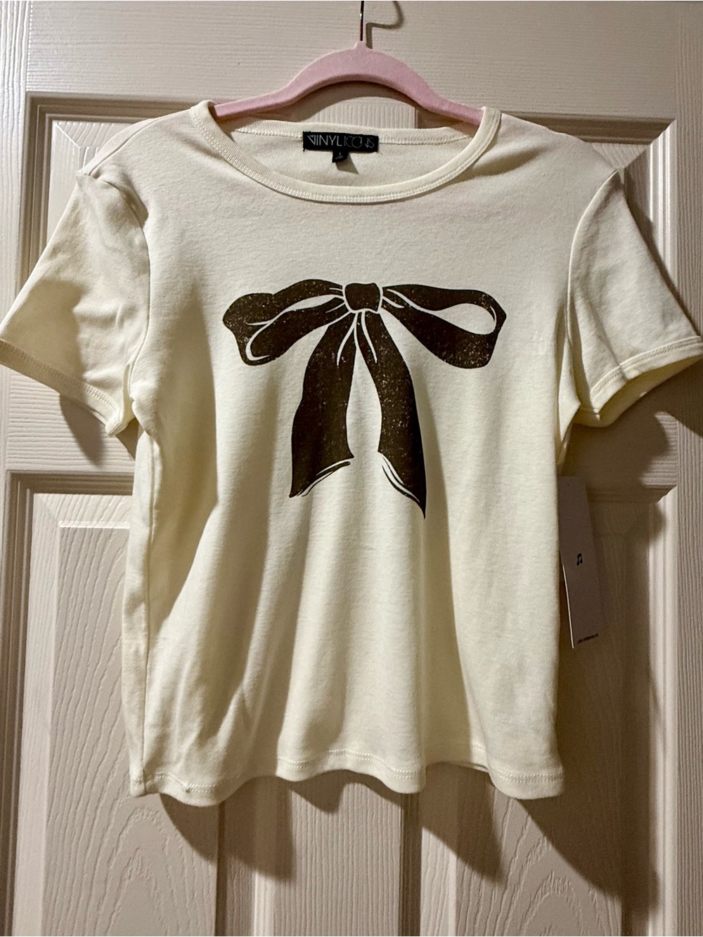 VINYLCID Cream Short Sleeve Tee with Black Bow Motif